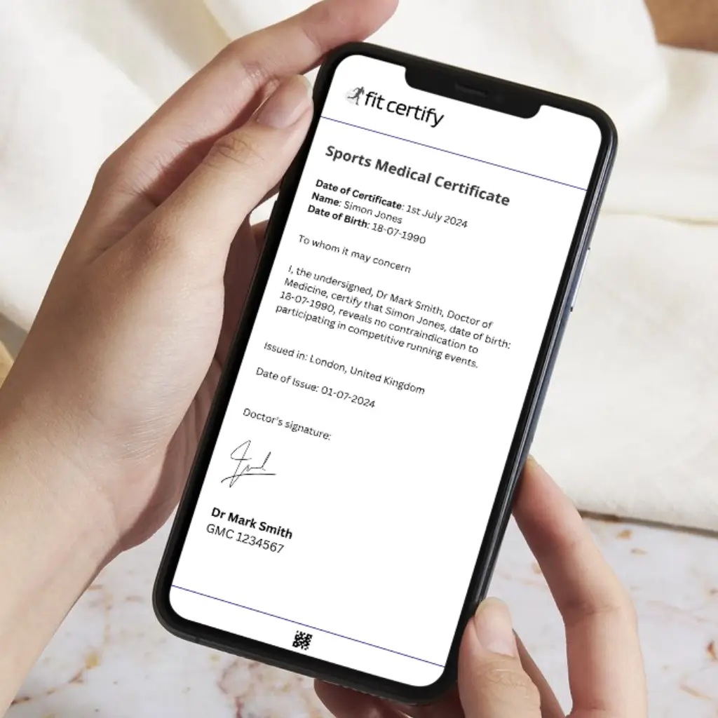 A person holding a mobile phone that is displaying a sports medical certificate from Fit Certify.