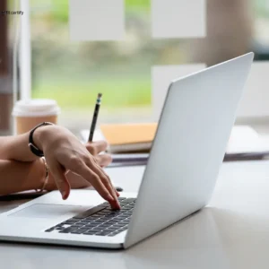 A laptop representing online services for getting a sports medical certificate.