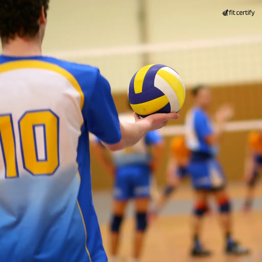 A team playing volleyball after getting their fit to play medical certificate from fit certify.